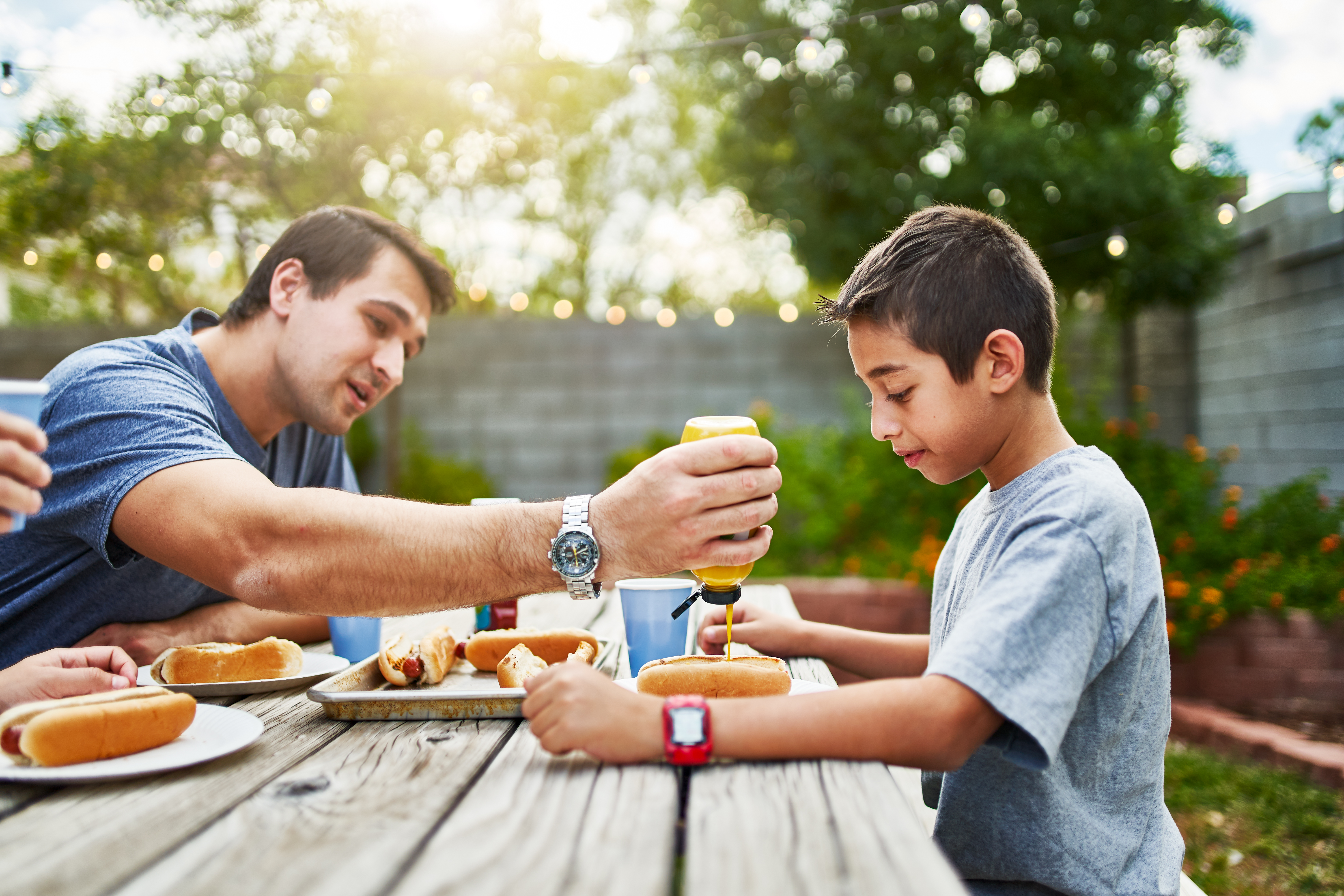 Boy BBQing with Father 